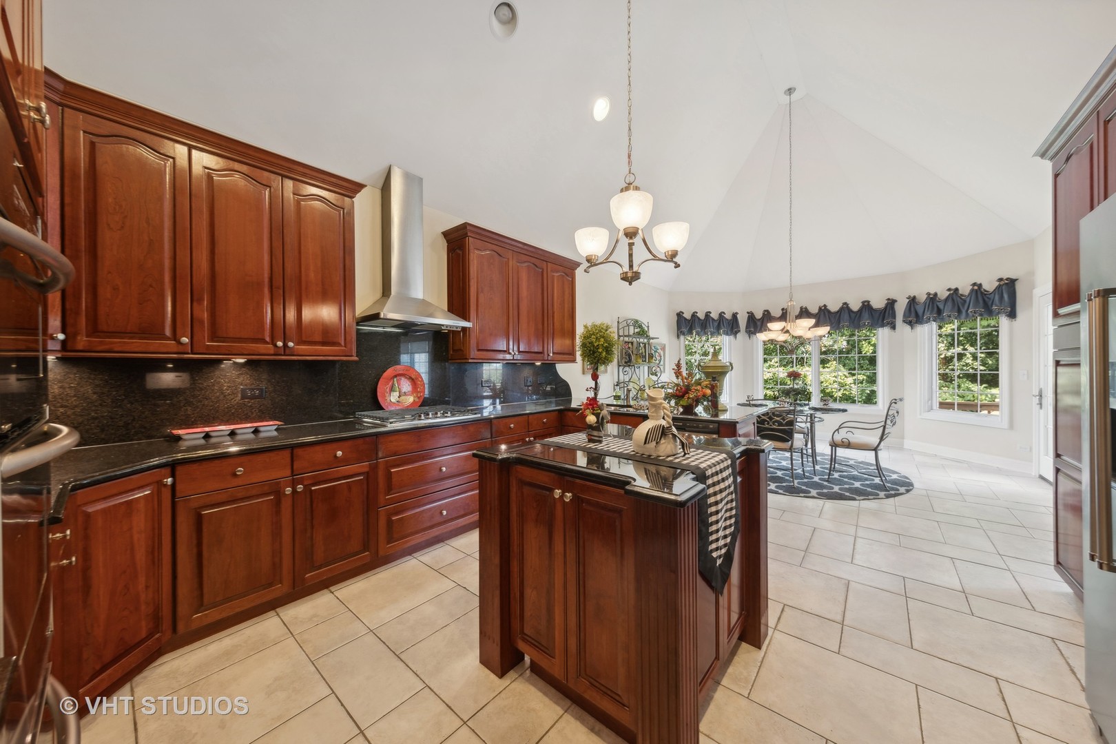 16736 Julie Ann Lane Orland Park, IL 60467 - Photo 14 of 36 a kitchen with stainless steel appliances granite countertop a stove a sink and a microwave