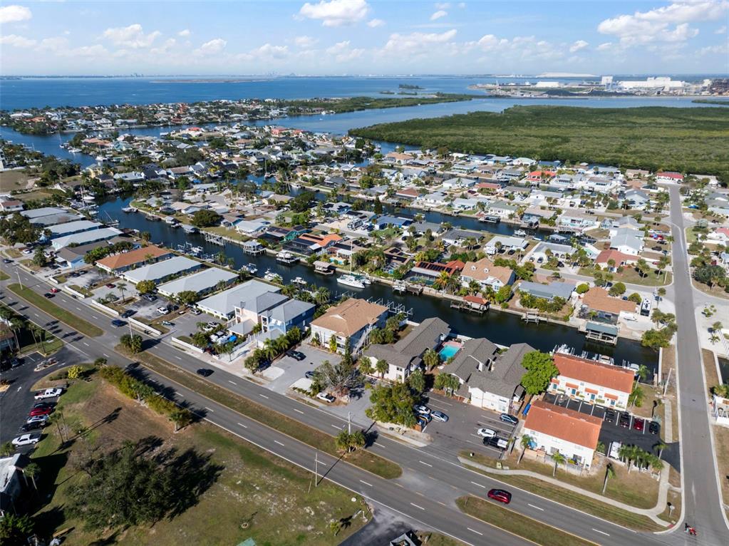 1013 Apollo Beach Boulevard, Unit 203 Apollo Beach, FL 33572 - Photo 6 of 26 an aerial view of a city with lots of residential buildings ocean and mountain view in back