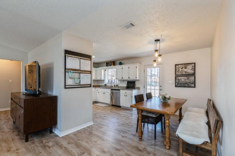 2763 Augustus Road Navarre, FL 32566 - Photo 8 of 31 a kitchen with a dining table and chairs