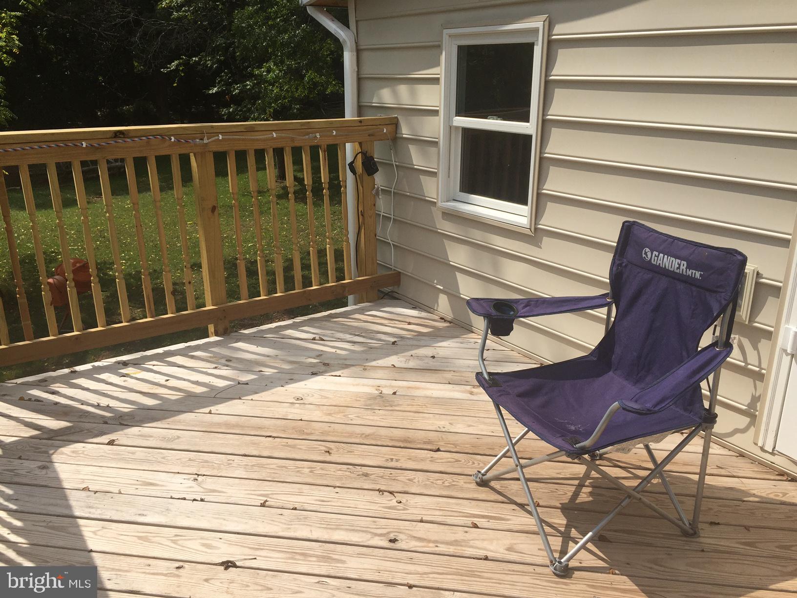 4609 B Dumfries Road Catlett, VA 20119 - Photo 16 of 16 a view of a chair and table in the wooden floor