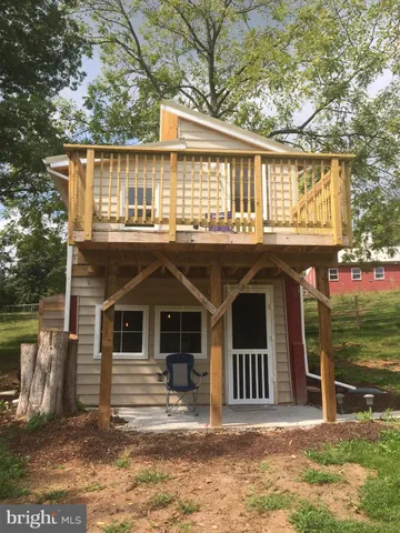 a front view of a house with a porch
