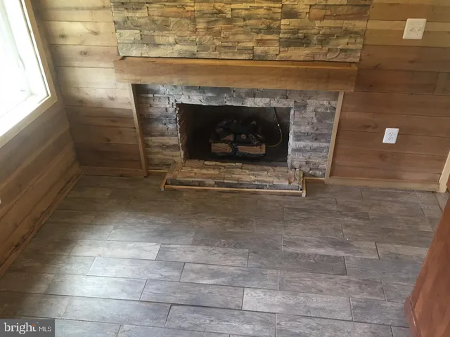 a living room with a fireplace