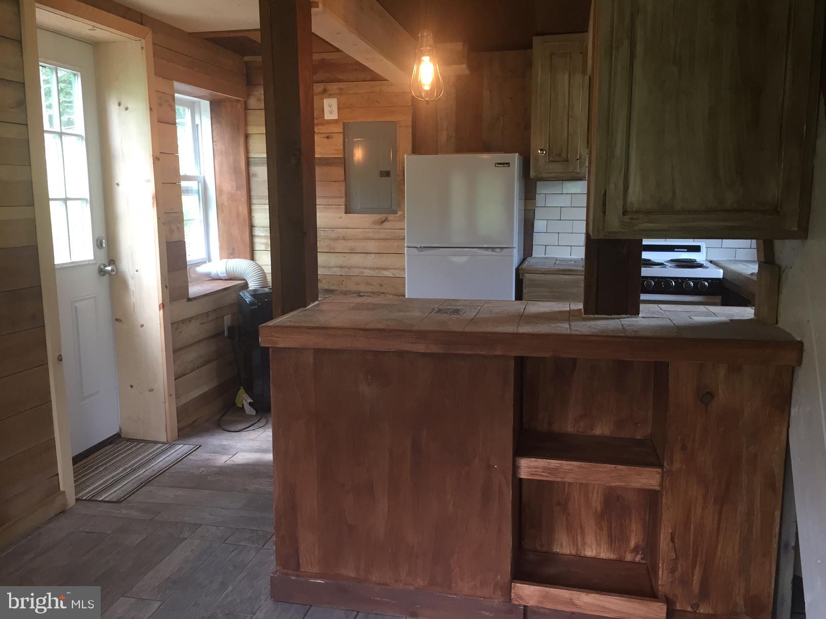 4609 B Dumfries Road Catlett, VA 20119 - Photo 8 of 16 a kitchen with stainless steel appliances granite countertop a refrigerator and a stove