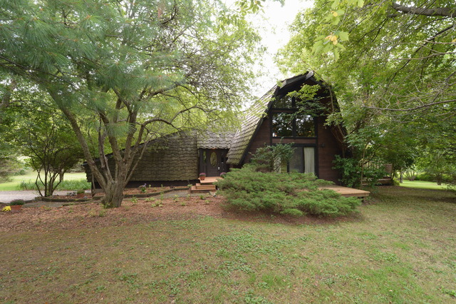 5N476 Brown Road St. Charles, IL 60175 - Photo 1 of 25 a front view of a house with garden