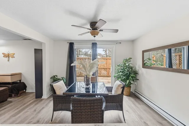 a dining room with furniture and window