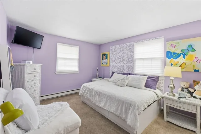 a bedroom with a bed and couch