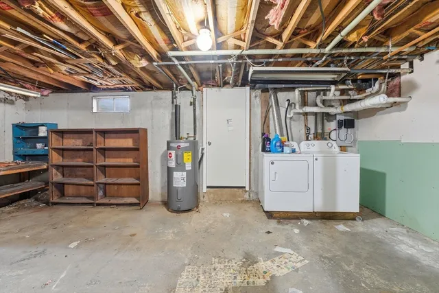 a kitchen with a refrigerator sink and cabinets