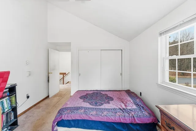 a bedroom with a bed and dresser