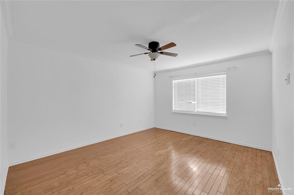 500 Wichita Avenue, Unit 17 McAllen, TX 78503 - Photo 12 of 16 an empty room with a window and a ceiling fan