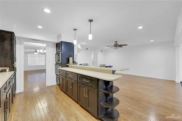 a kitchen with a sink and a refrigerator