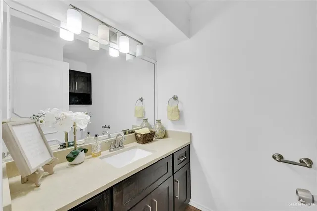 a bathroom with a sink double vanity and a mirror