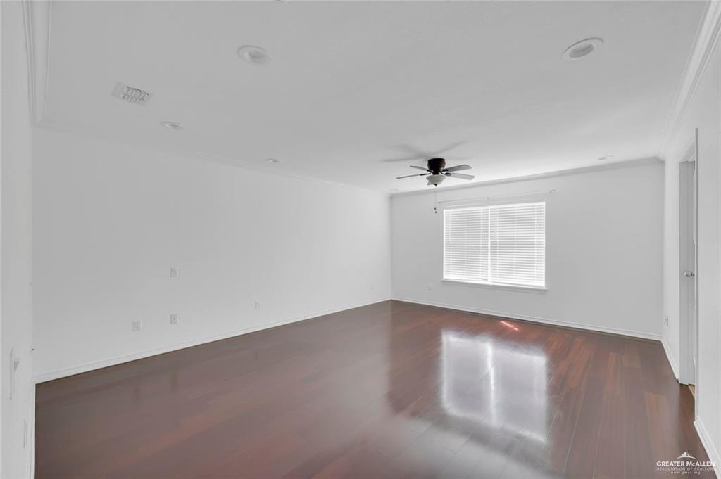 500 Wichita Avenue, Unit 17 McAllen, TX 78503 - Photo 9 of 16 wooden floor in an empty room with a window