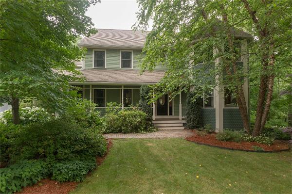 205 Marrett Road Lexington, MA 02421 - Photo 1 of 16 a front view of a house with garden