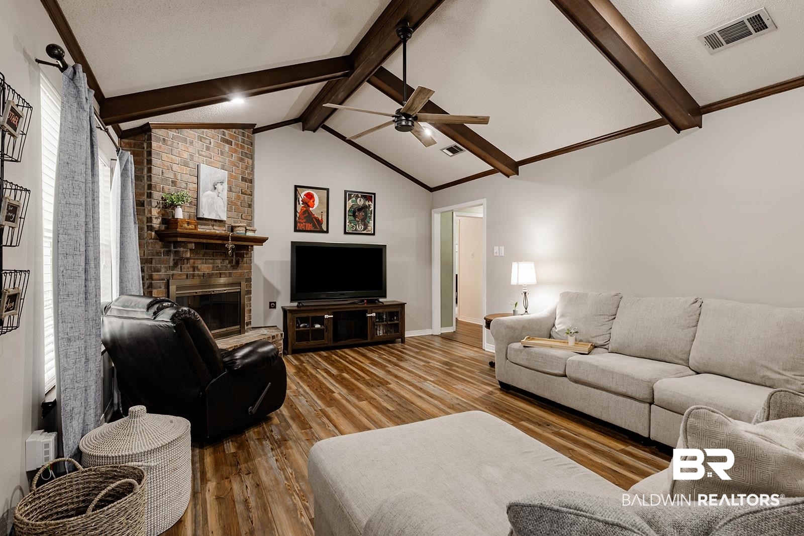 2920 Quail Creek Run Mobile, AL 36695 - Photo 13 of 33 Living area featuring a ceiling fan, wood finished floors, and a brick fireplace