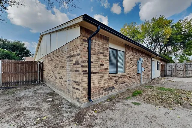 a white toilet sitting next to a bath tub and a shower