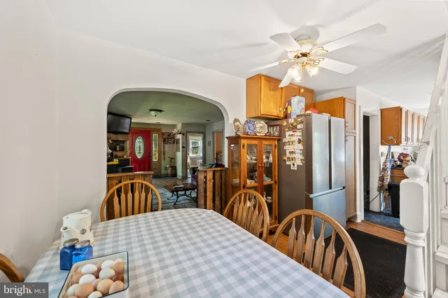 a bedroom with furniture and chandelier