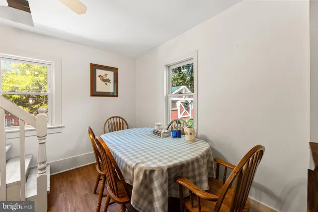 a view of a dining room with furniture and a window