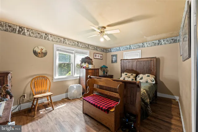 a bedroom with furniture and a window