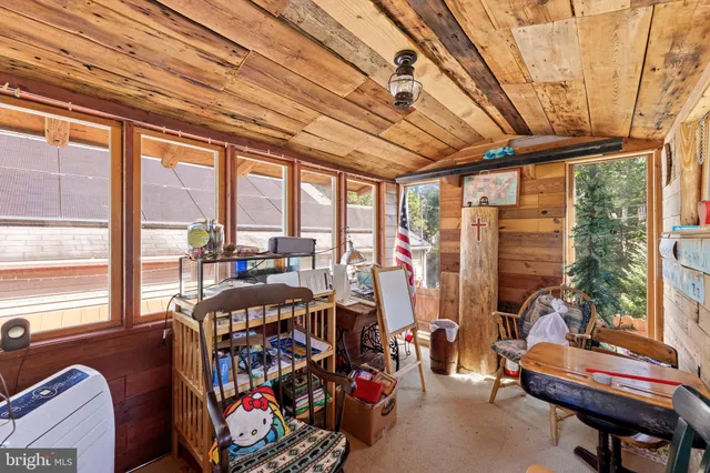 a outdoor space with lots of furniture and water view