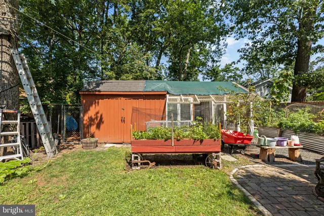a backyard of a house with yard and outdoor seating
