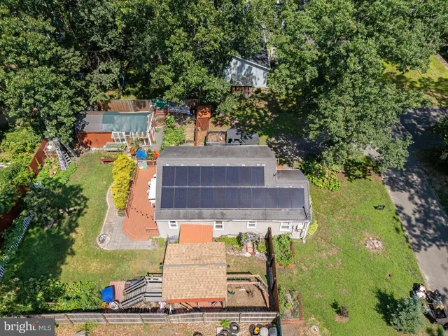 an aerial view of a house with swimming pool
