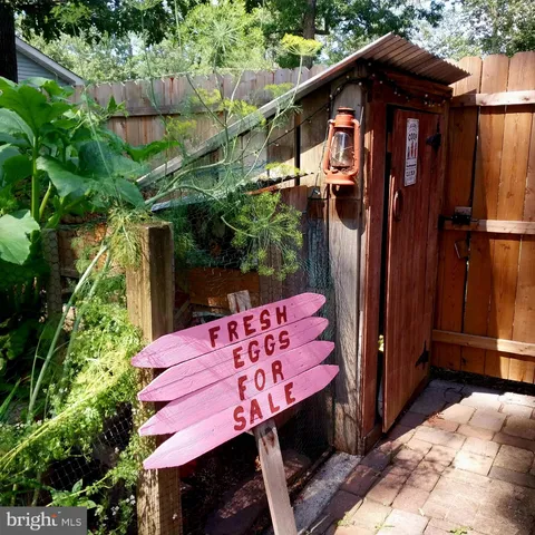 a view of a wooden door with a red chair