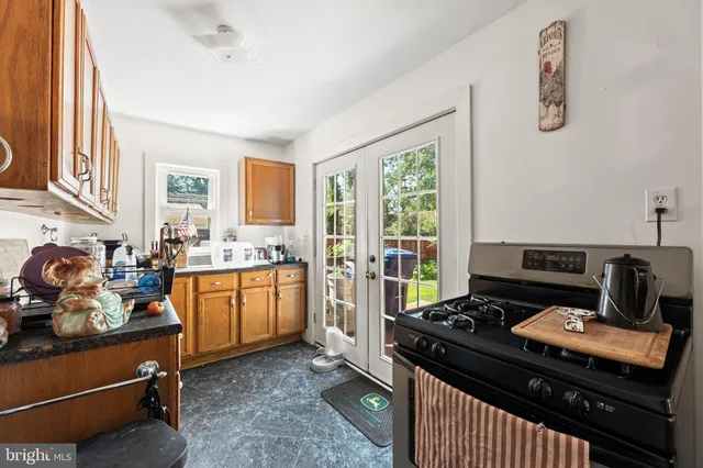 a kitchen with a stove and a sink