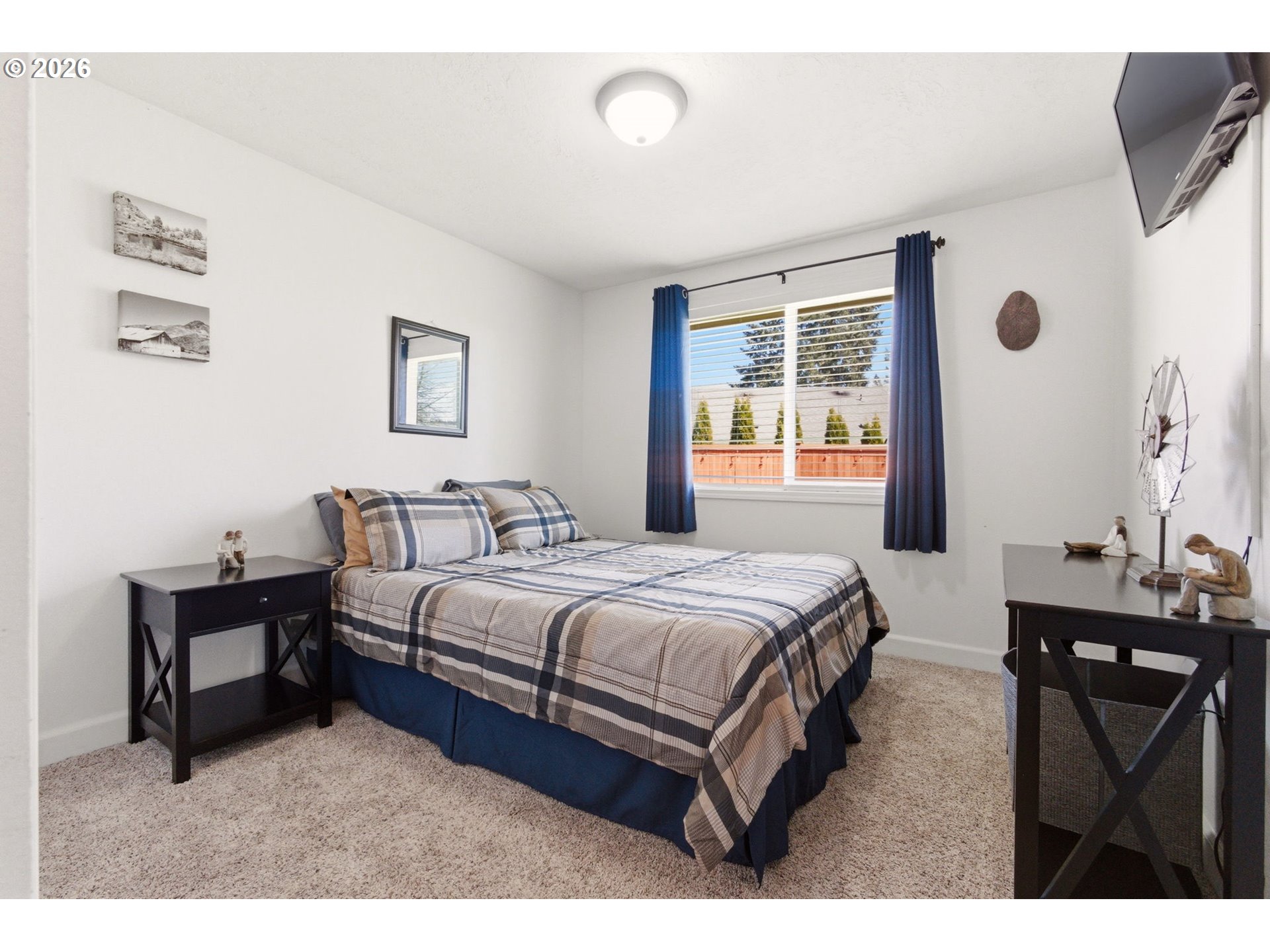 6 Dove Street Longview, WA 98632 - Photo 13 of 14 a bedroom with a bed mirror and window