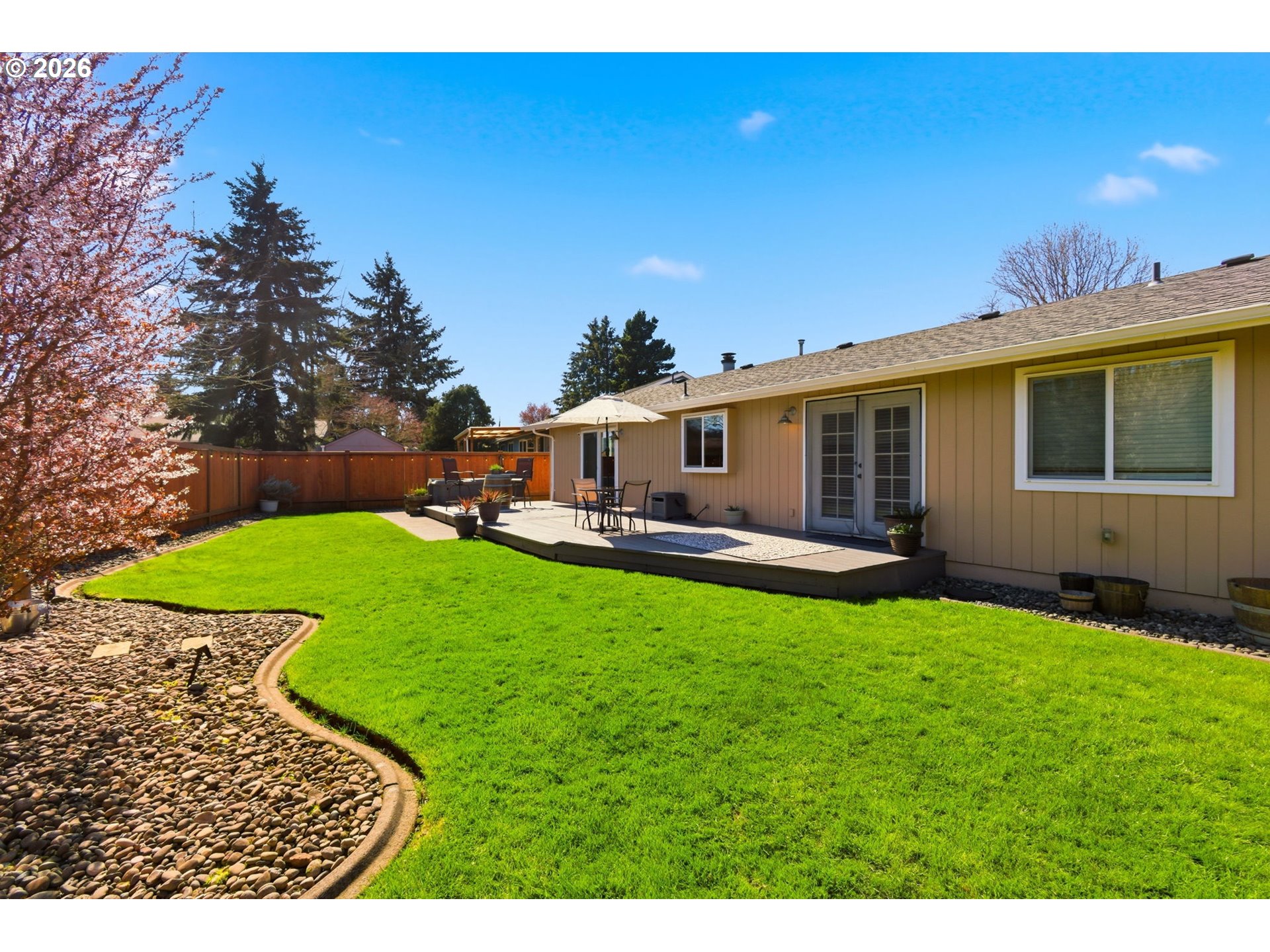 6 Dove Street Longview, WA 98632 - Photo 14 of 14 a view of a house with a backyard porch and sitting area