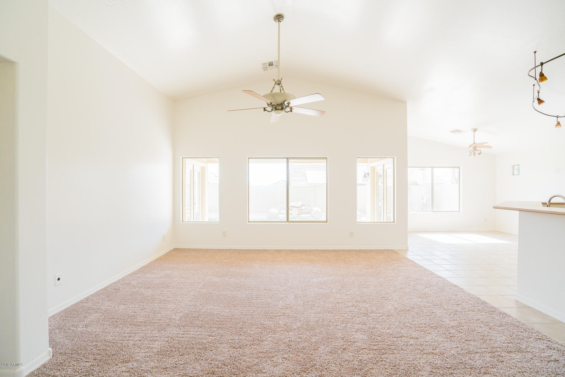 25555 West Ripple Road Buckeye, AZ 85326 - Photo 4 of 21 a view of an empty room with a window