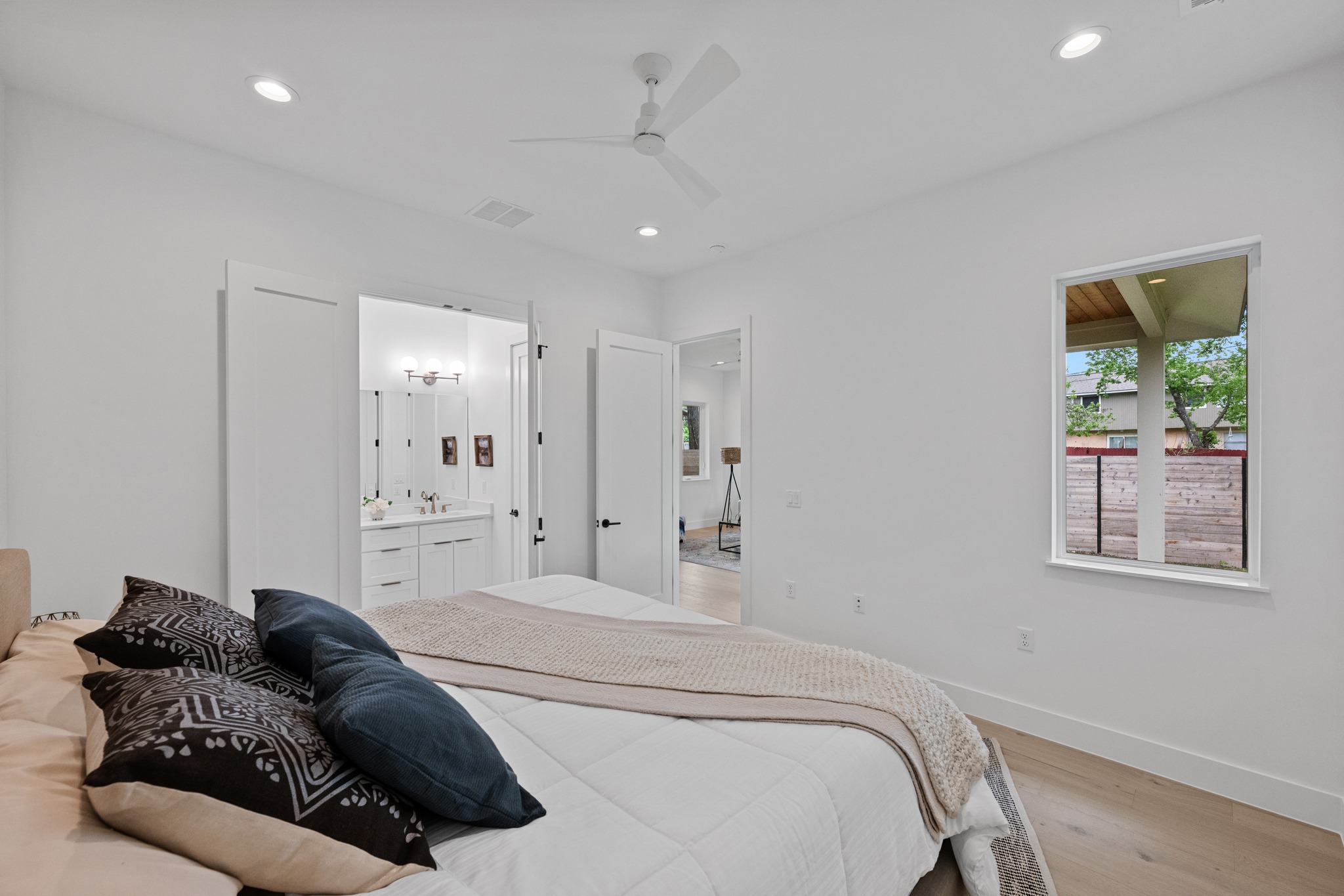 3614 Abbate Circle, Unit A Austin, TX 78721 - Photo 14 of 29 Bedroom featuring light wood flooring and recessed lighting