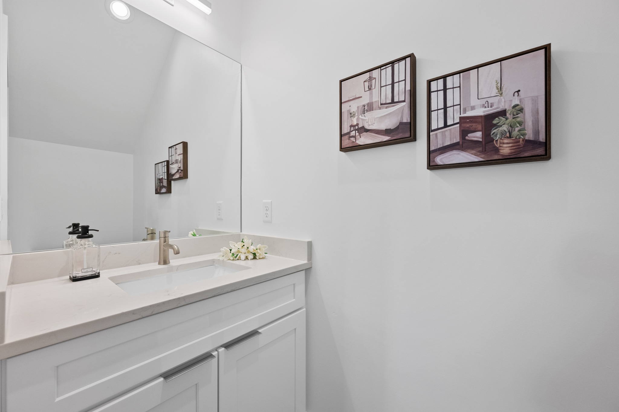 3614 Abbate Circle, Unit A Austin, TX 78721 - Photo 22 of 29 Bathroom vanity with an integrated sink, brushed nickel faucet, and a large mirror