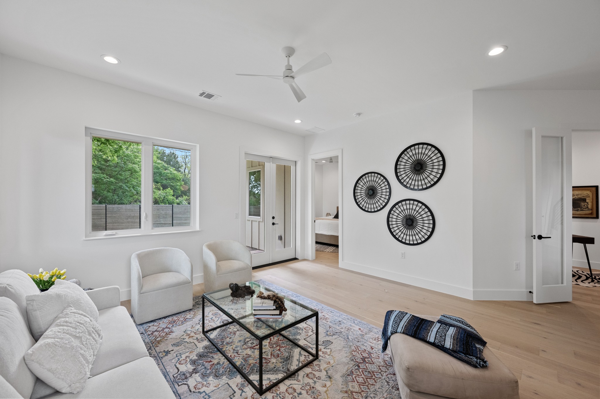 3614 Abbate Circle, Unit A Austin, TX 78721 - Photo 3 of 29 The living area features light-colored flooring, recessed lighting, and a ceiling fan