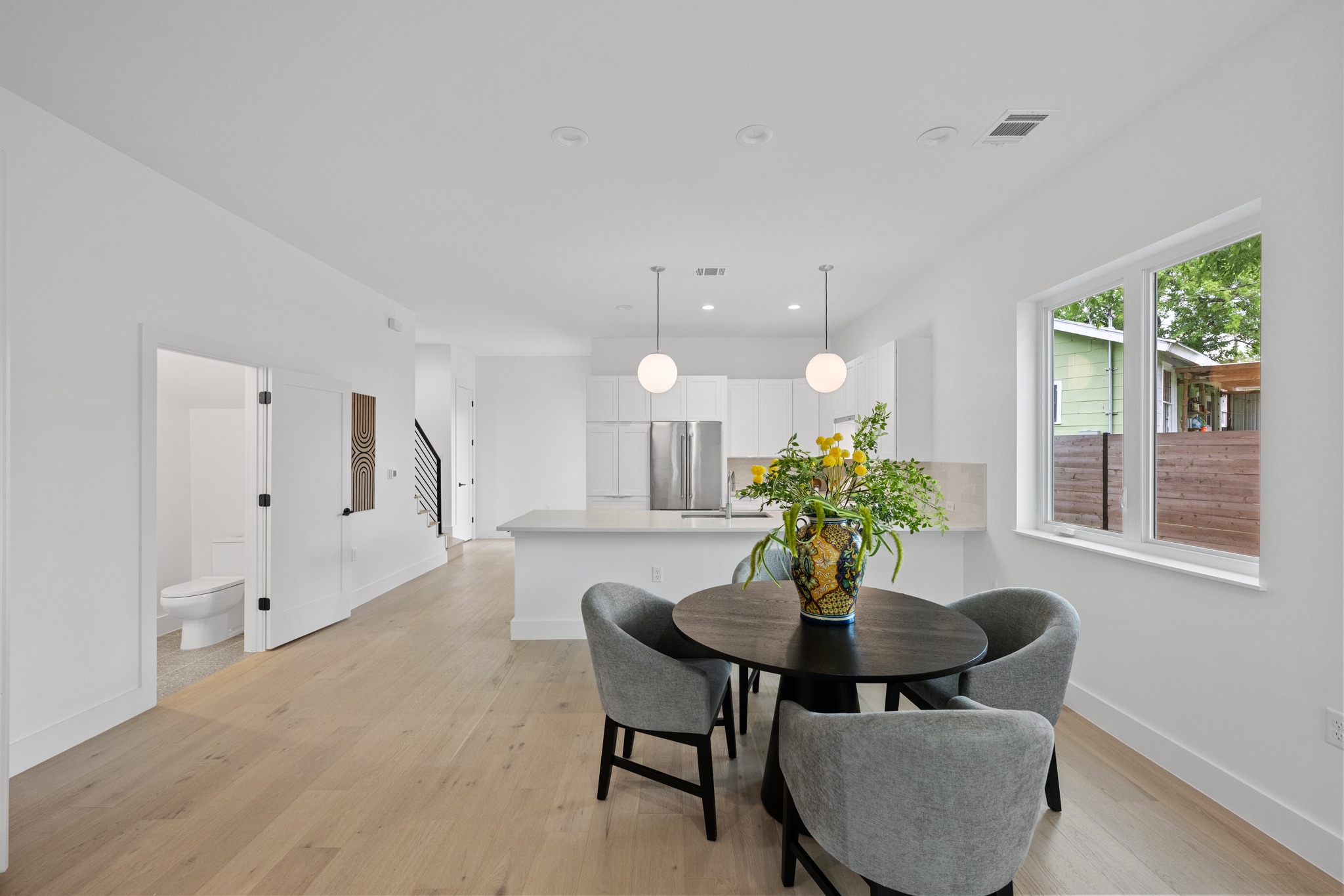 3614 Abbate Circle, Unit A Austin, TX 78721 - Photo 4 of 29 This open-concept living area features light hardwood flooring, recessed lighting, and a window providing natural light