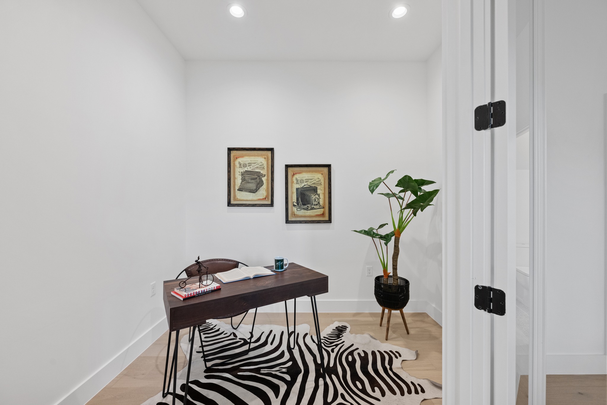 3614 Abbate Circle, Unit A Austin, TX 78721 - Photo 10 of 29 This versatile space features light wood flooring, white walls, and recessed lighting