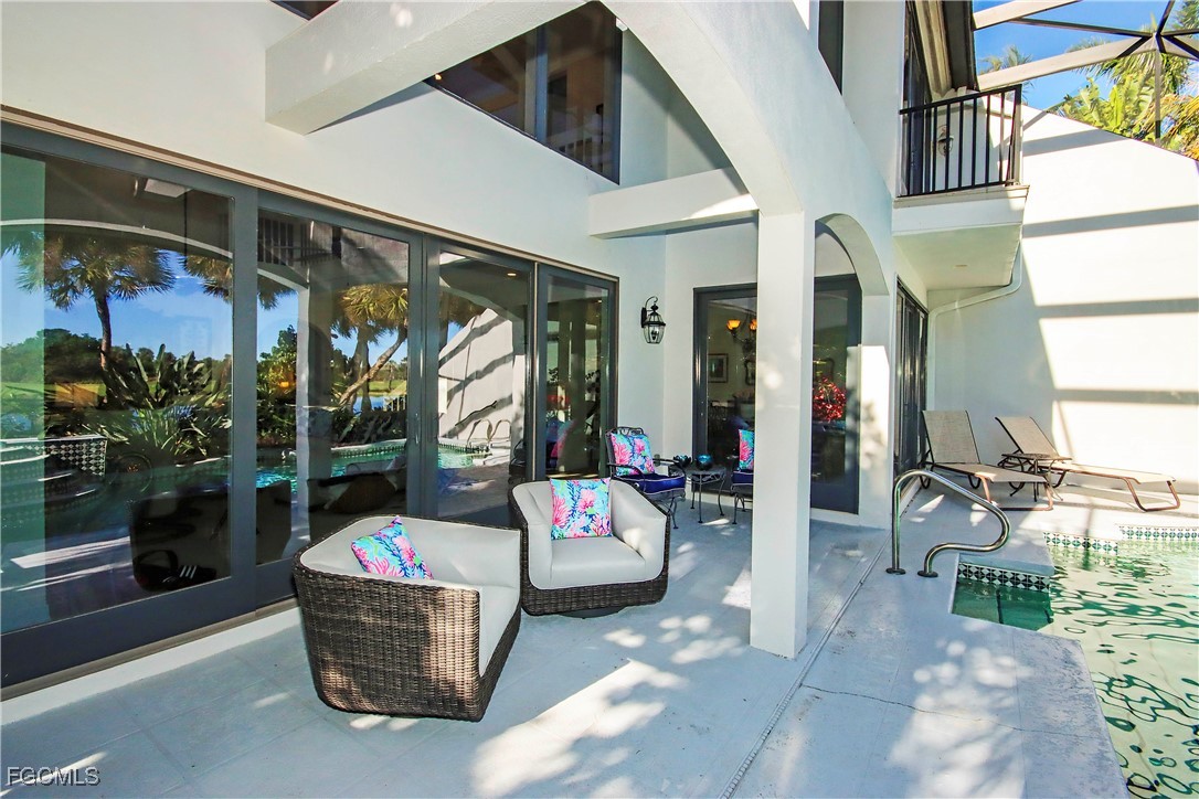 2548 Wulfert Road Sanibel, FL 33957 - Photo 14 of 36 a outdoor living space with patio furniture and a potted plant