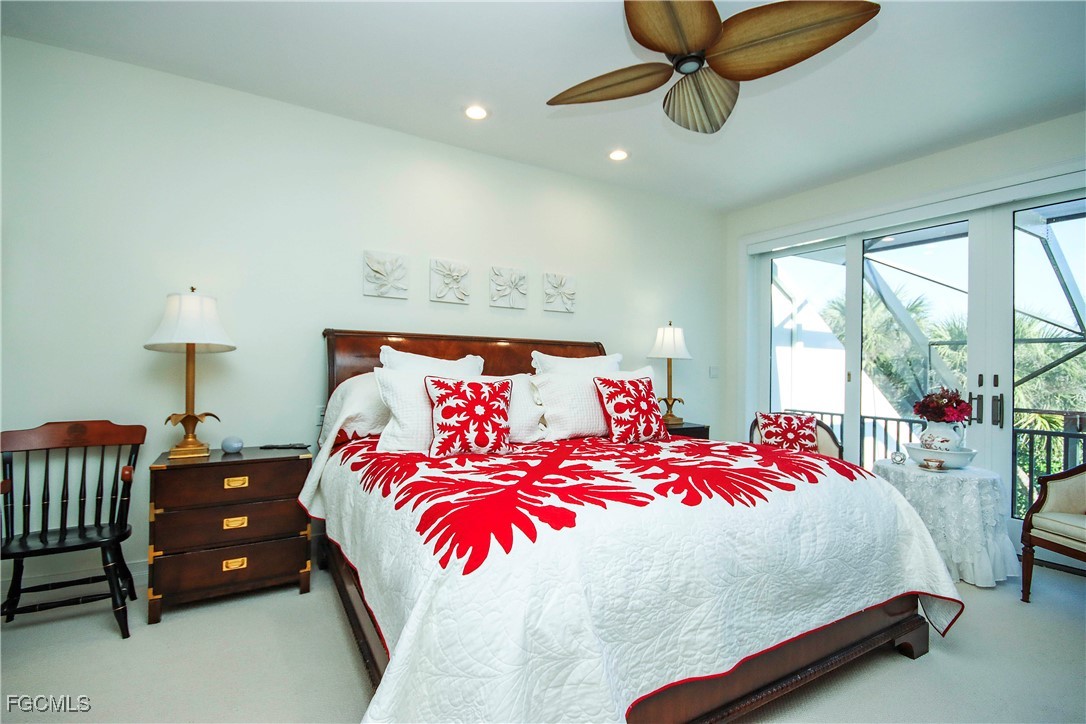 2548 Wulfert Road Sanibel, FL 33957 - Photo 17 of 36 a bedroom with a bed and window