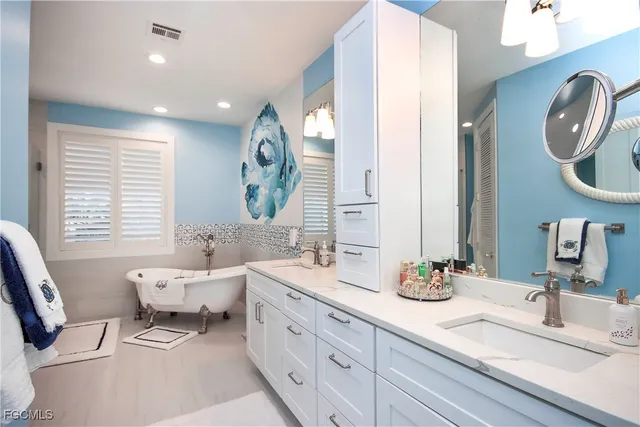 a bathroom with a bathtub and shower