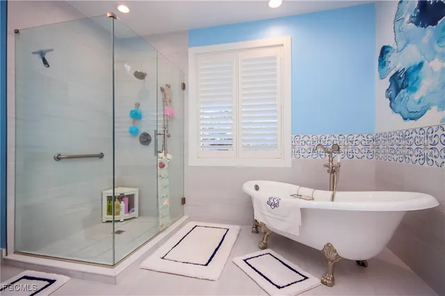 a spacious bathroom with a granite countertop sink and a mirror