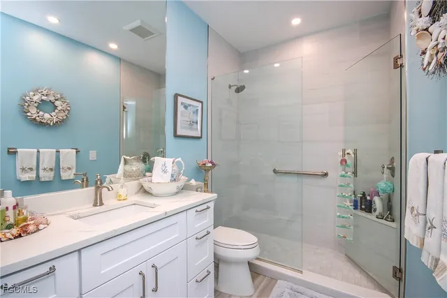 a bedroom that has a bed and a table in it