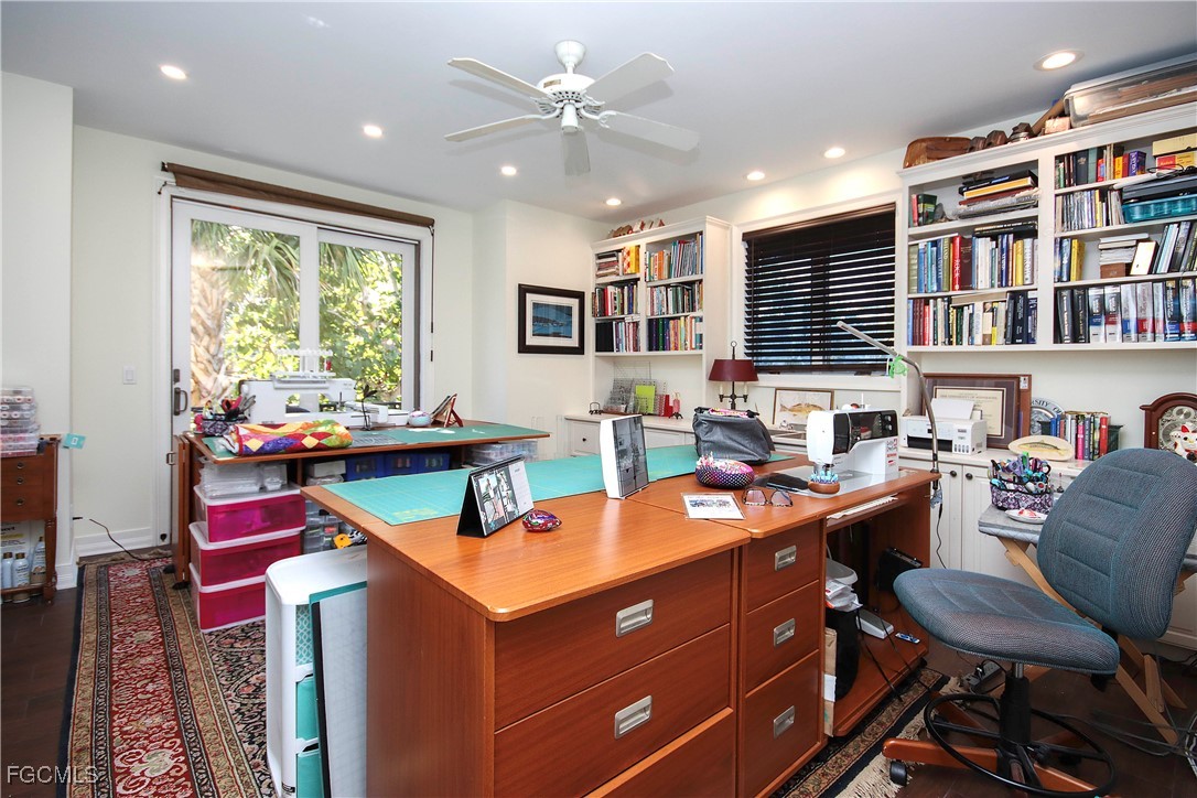 2548 Wulfert Road Sanibel, FL 33957 - Photo 31 of 36 a room with a large window and furniture