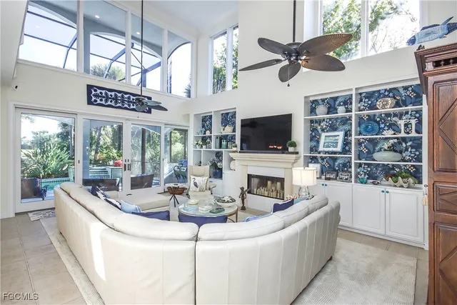 a living room with fireplace furniture and a flat screen tv