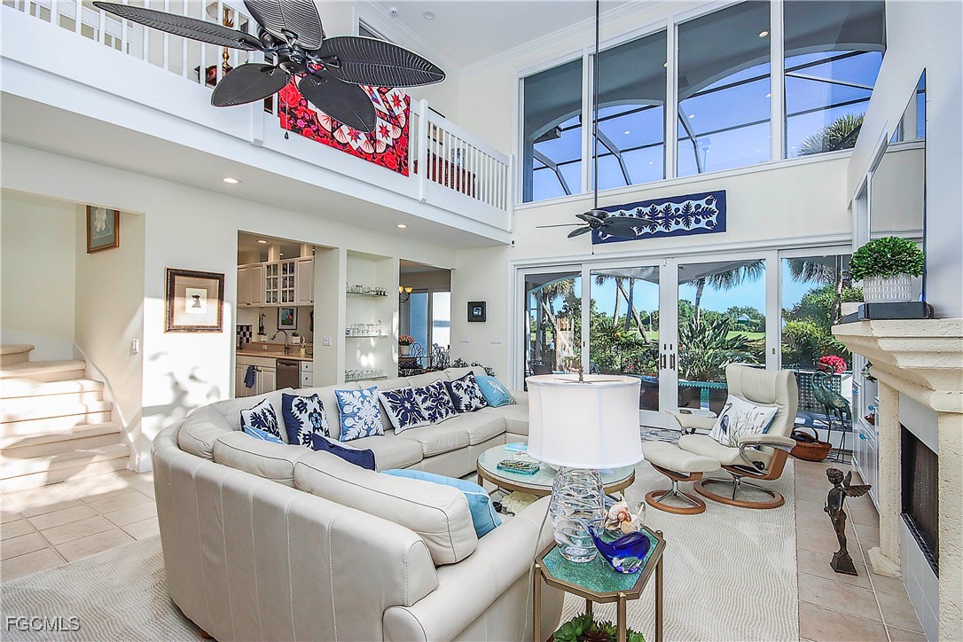 2548 Wulfert Road Sanibel, FL 33957 - Photo 8 of 36 a living room with furniture and a potted plant