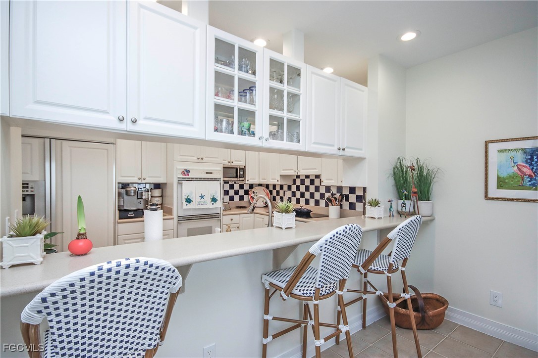 2548 Wulfert Road Sanibel, FL 33957 - Photo 9 of 36 a dining room with furniture and window