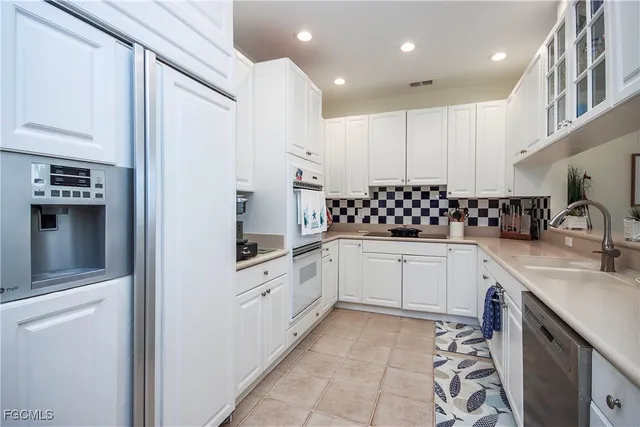 a view of a dining room with furniture and a chandelier