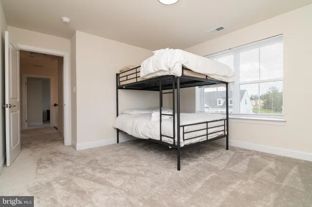 a bathroom with a sink toilet and a mirror