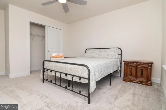 a bedroom with a bed and a television in it