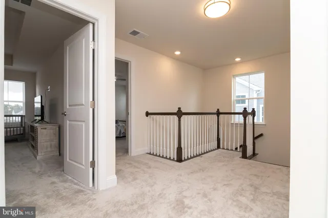 workspace with wooden floor and windows