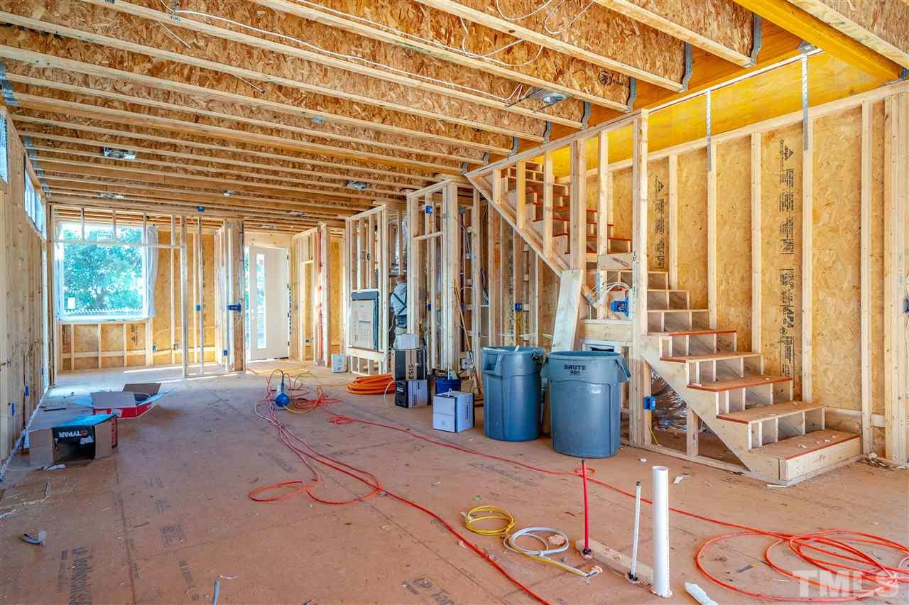 1212 Garner Road Raleigh, NC 27610 - Photo 14 of 22 a living room with furniture and large windows
