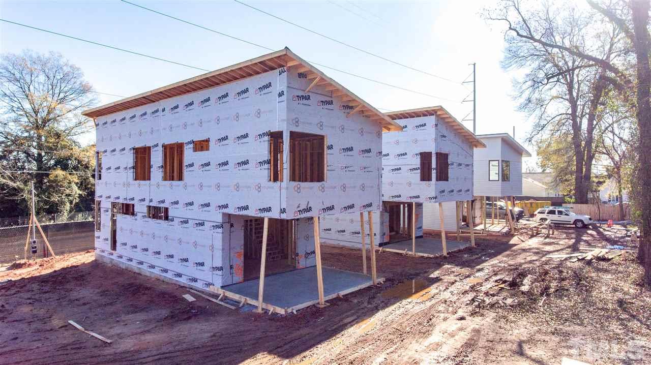 1212 Garner Road Raleigh, NC 27610 - Photo 9 of 22 a front view of a house with a yard